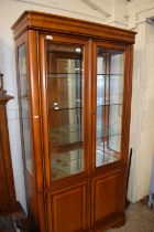 Modern lounge display cabinet with mirrored top section and cupboard base