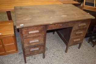 An oak veneered twin pedestal office desk, 125cm wide