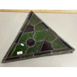 Group of four triangular lead glazed coloured glass panels