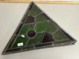 Group of four triangular lead glazed coloured glass panels