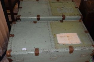 A pair of vintage painted packing trunks