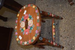 A floral painted kitchen stool