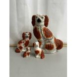 Group of four Staffordshire model Spaniels