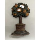 Cast iron door stop in the form of an orange tree