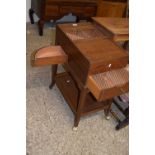 Finnegans Ltd, New Bond Street, London, an unusual tambour top mahogany cabinet with push out side