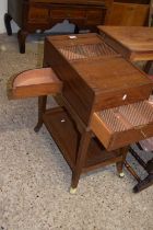 Finnegans Ltd, New Bond Street, London, an unusual tambour top mahogany cabinet with push out side