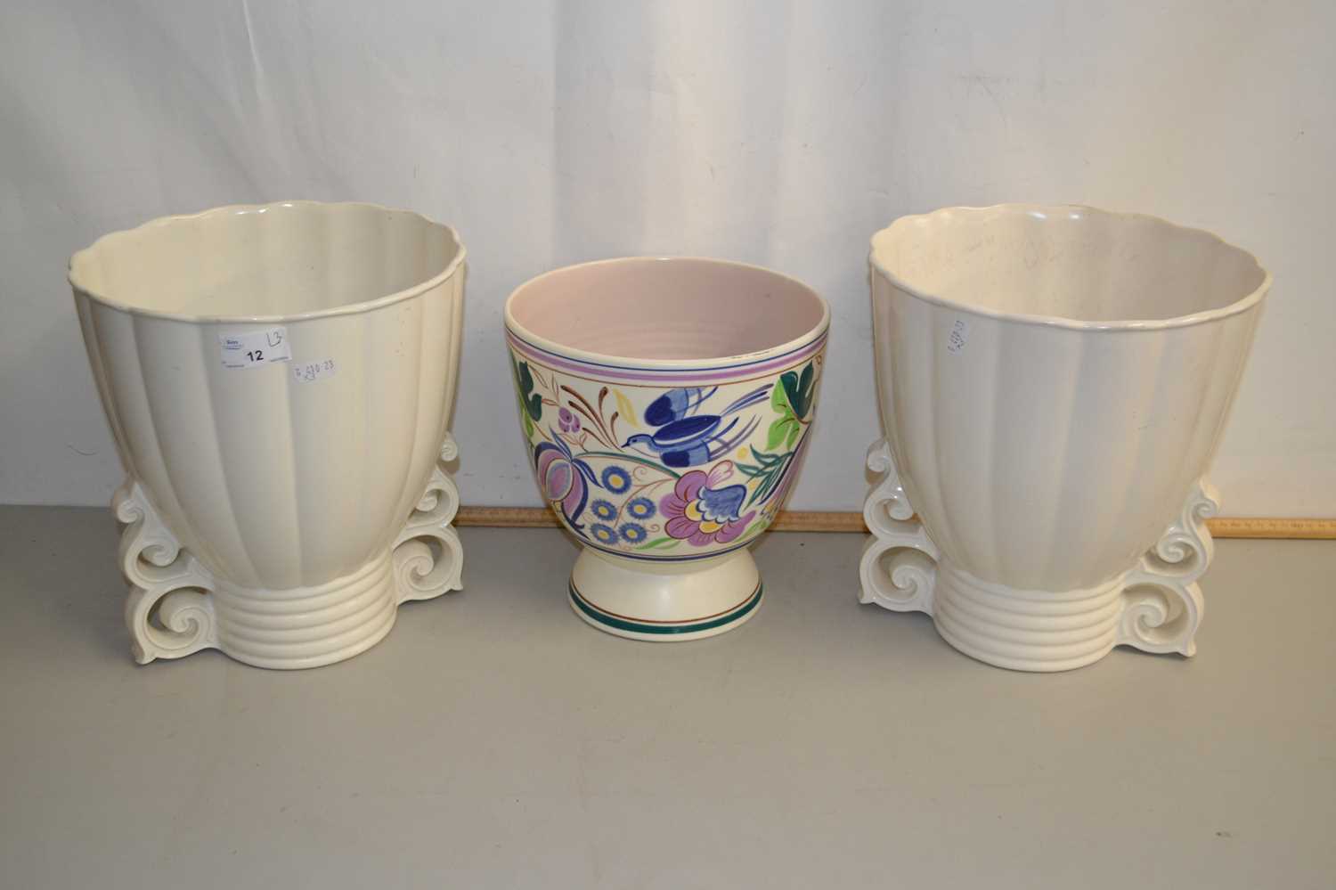 A pair of Wade jardinieres together with a Poole Pottery jardiniere (3)