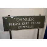 Metal signed marked "Danger Please Keep Clear of Walls"