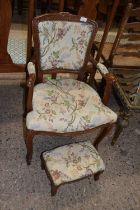 A small French oak framed upholstered armchair with accompanying stool (2)