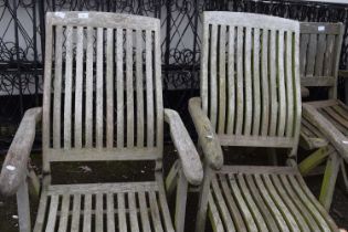 A pair of hardwood garden lounger chairs