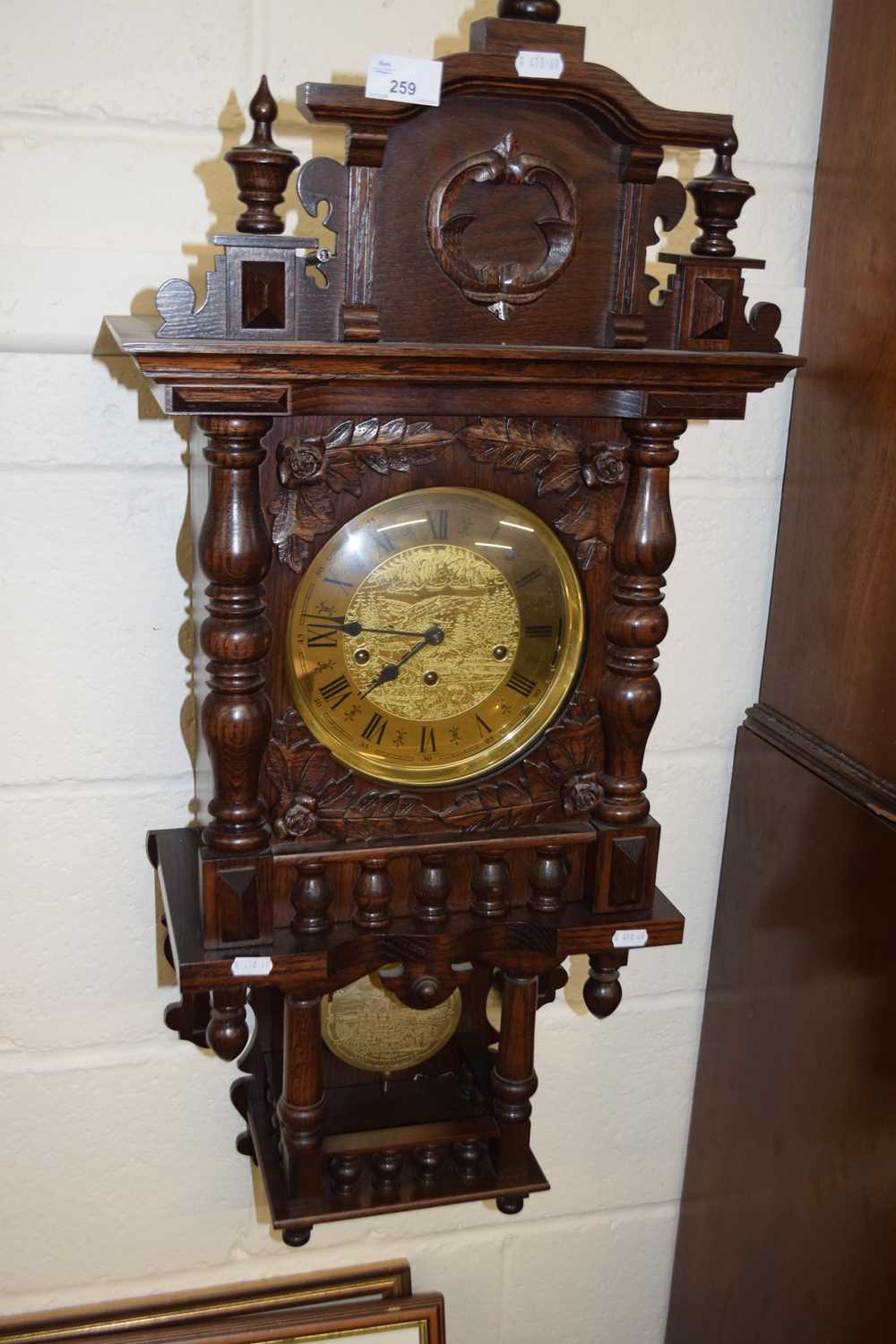 20th Century oak cased wall clock with brass movement striking on rods