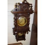 20th Century oak cased wall clock with brass movement striking on rods