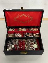 A case of various assorted costume jewellery