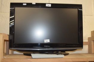 A Toshiba TV and remote control