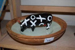 Turned wooden bowl, plate and a pottery cow