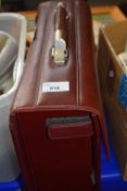 A Tergan burgundy leather briefcase