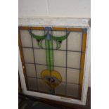 An Art Nouveau lead glazed coloured glass window panel, 75 x 90cm