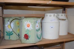 Pair of floral painted metal ware jugs and a pair of cream decorative milk urns