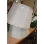 Three cream lampshades