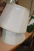 Three cream lampshades