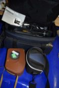 A Panasonic RX14 VHS movie camera with accessories and bag and two other cameras
