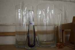 Two cylindrical glass vases and two contemporary glass vases