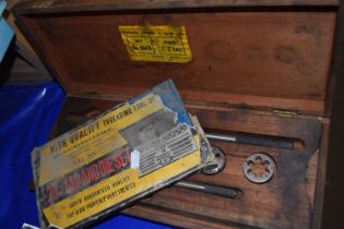 A tap and die set and a wooden sprocket set