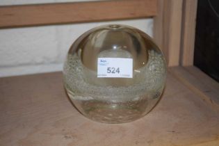 A large glass paperweight