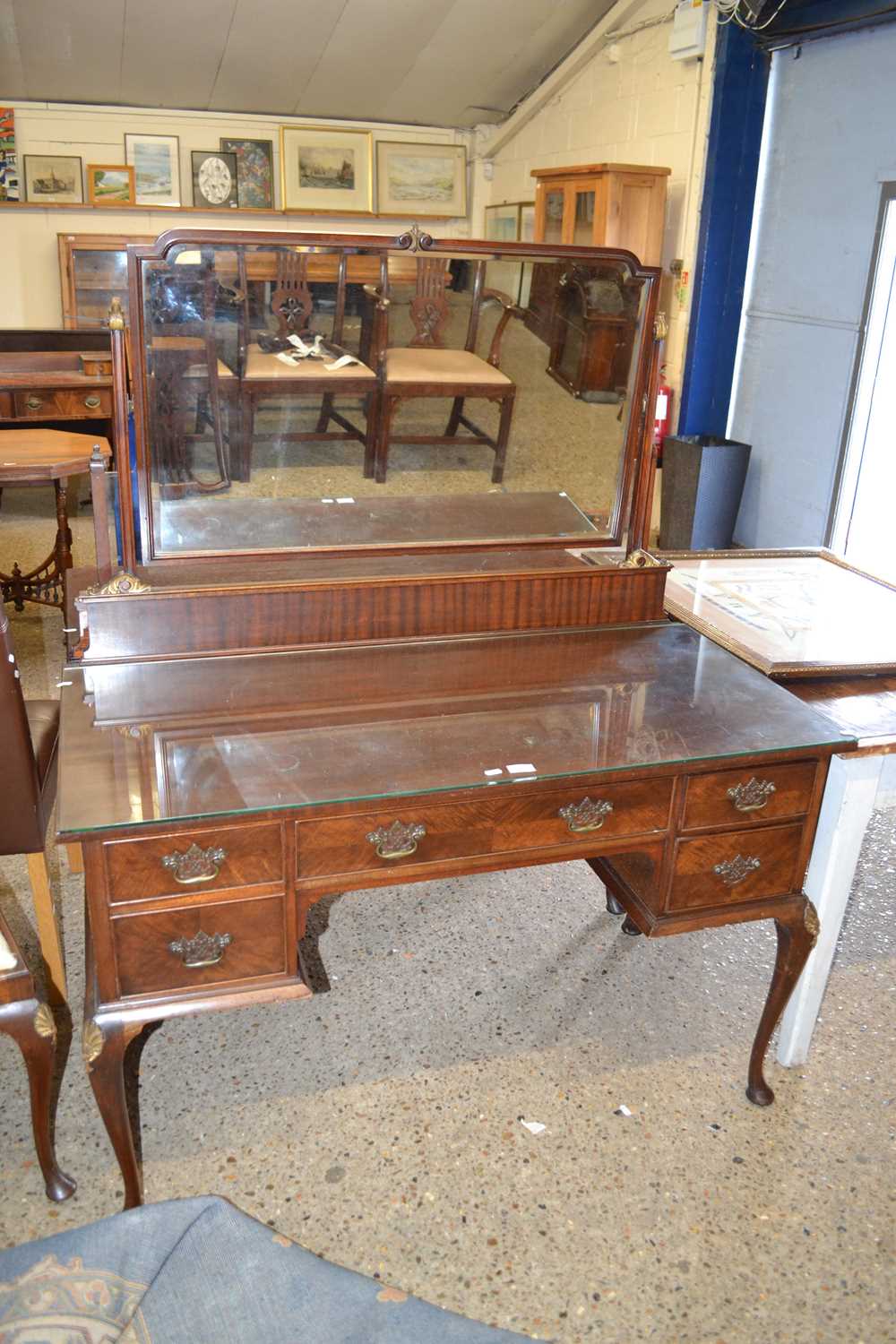 A Georgian revival mahogany dressing table with mirrored back