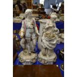 A pair of large continental porcelain figures, 65cm high, significantly damaged