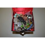 A black case of various assorted costume jewellery