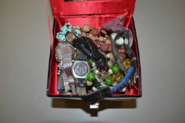 A black case of various assorted costume jewellery