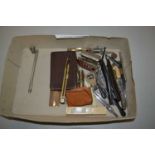 A box of various assorted technical drawing instruments and other items