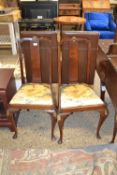 A pair of Georgian revival dining chairs with floral upholstered seats