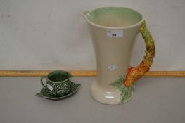 A Clarice Cliff jug, model number 672 together with a further Sylvac jug and dish