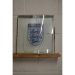 A double glazed panel decorated with the England Football emblem