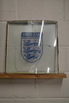 A double glazed panel decorated with the England Football emblem