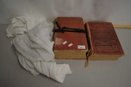 Two volumes of Kelly's Directory 1892 and 1937 together with two vintage Christening gowns