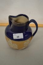 A Doulton stone ware harvest jug with silver collar