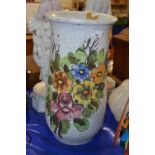 A large pottery vase or stick stand with floral decoration