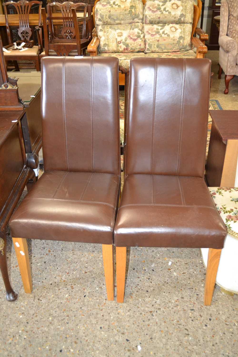 Pair of modern brown leather dining chairs