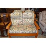 Wood framed two seater sofa and matching pair of armchairs