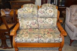 Wood framed two seater sofa and matching pair of armchairs