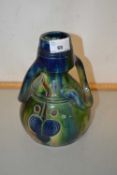 A Belgian Arts & Crafts type treacle glazed vase