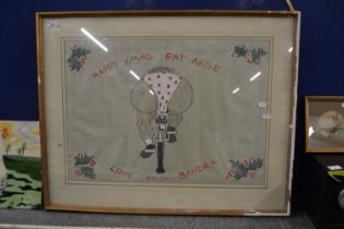 A comical cycling print marked Happy Xmas Fat Arse Love From Sandra, framed and glazed