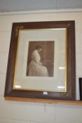 An Edwardian sepia print of a seated lady