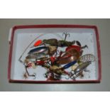 Small box of various fishing lures