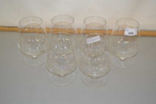 A set of six modern clear glass brandy balloons