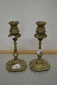 A pair of early 20th Century brass candlesticks