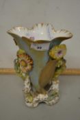 A 19th Century English porcelain vase decorated with flowers in relief, together with a 19th Century